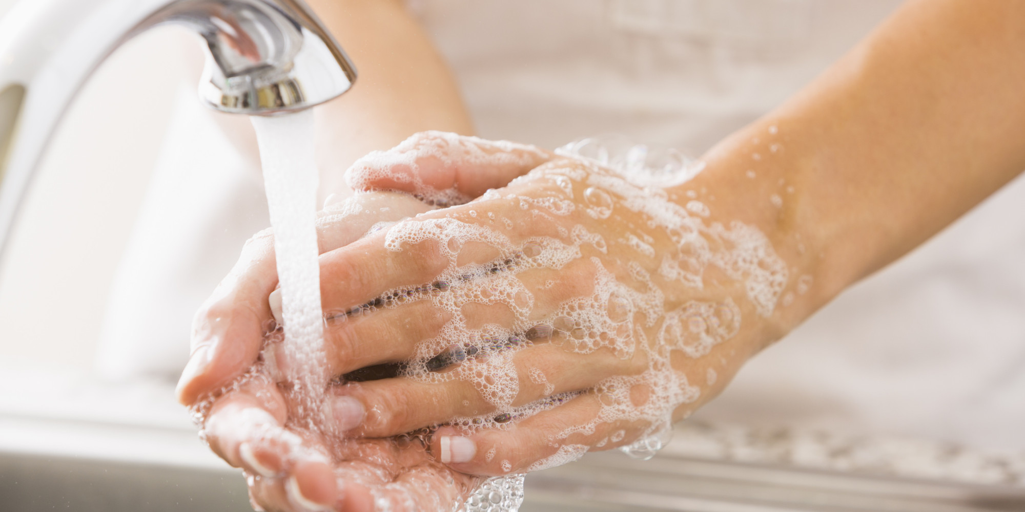 Caucasian woman washing her hands